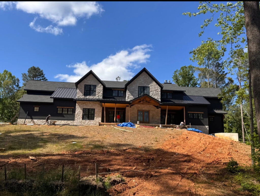 Roofing project gallery: new construction home with a black standing seam metal roof in Jasper, GA